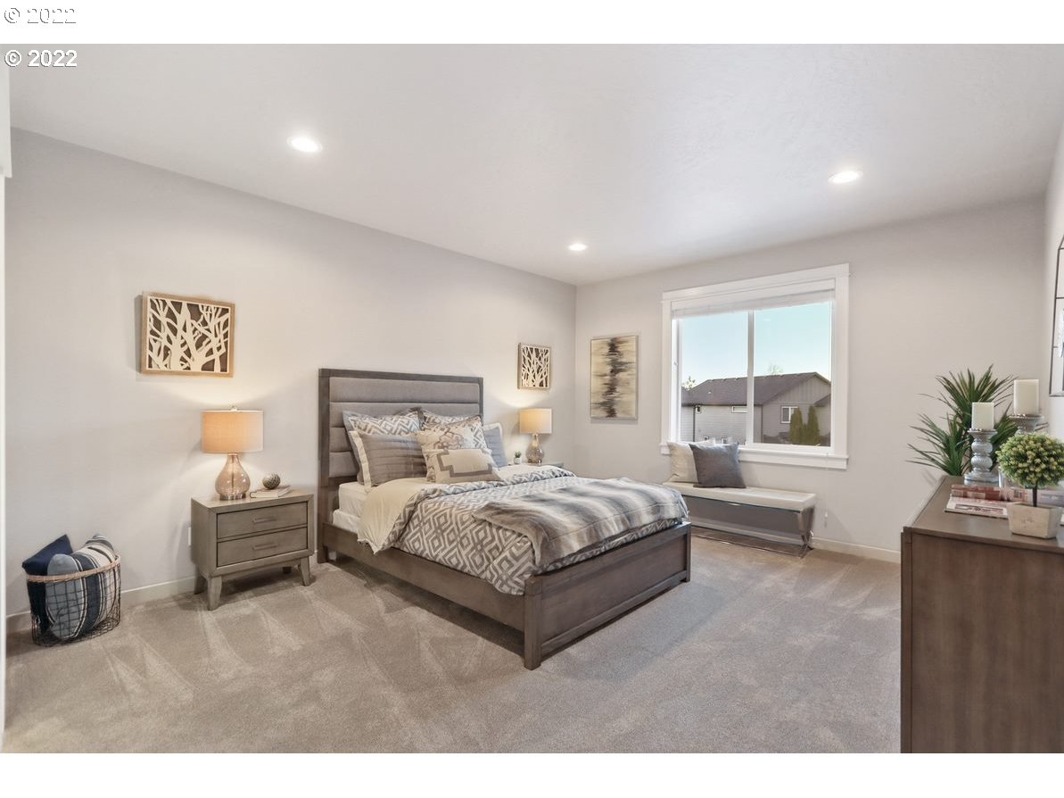 5325 Squirrel Street Springfield, OR 97478 - Photo 4 of 6 a bedroom with a bed and a couch