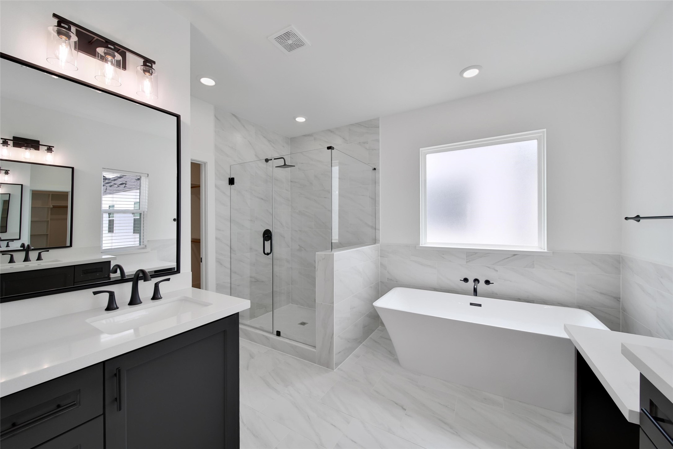 717 Marcella Street, Unit F Houston, TX 77091 - Photo 11 of 37 a bathroom with a double vanity sink mirror and double