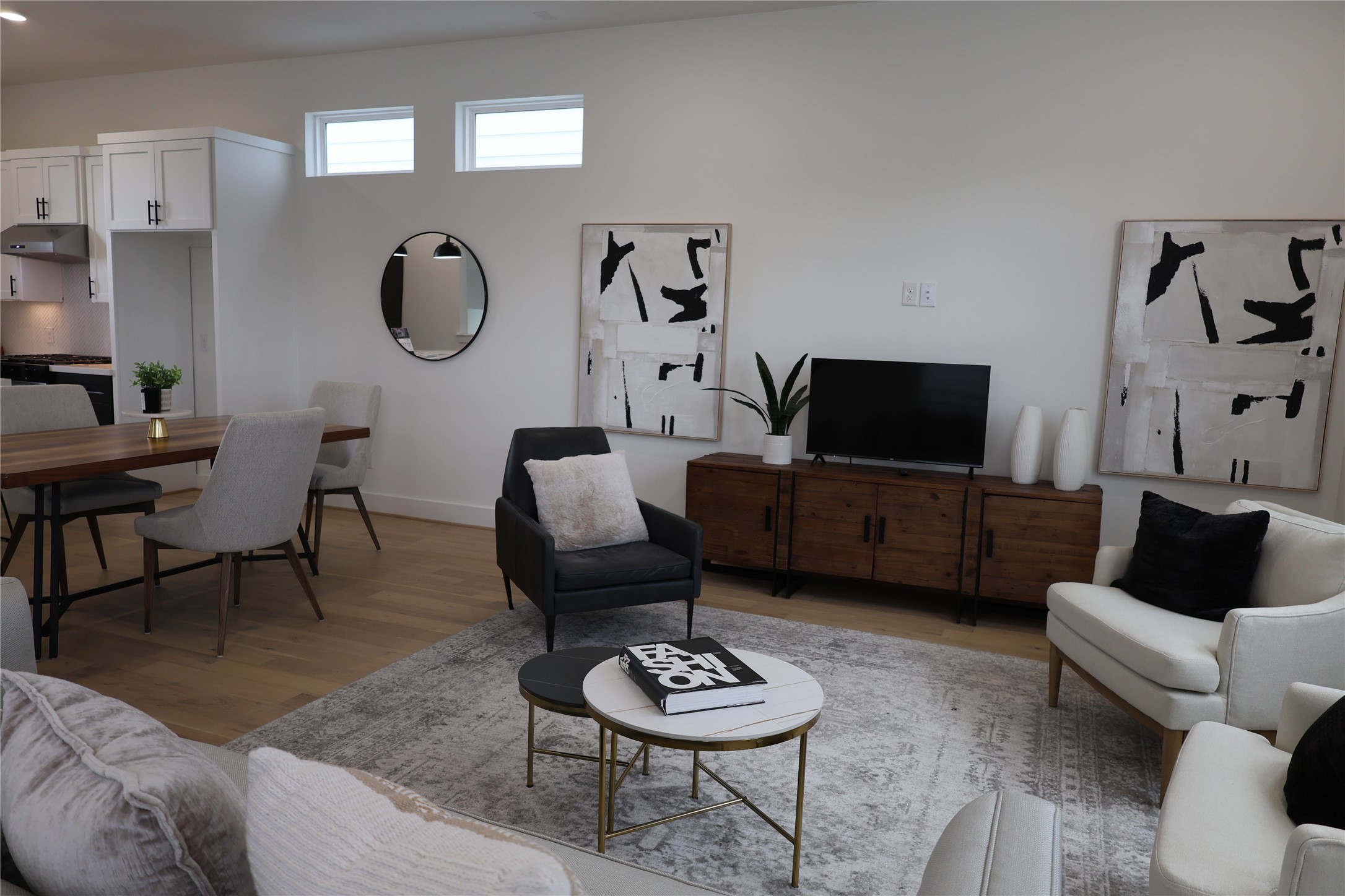 717 Marcella Street, Unit F Houston, TX 77091 - Photo 22 of 37 a living room with furniture a flat screen tv and a window
