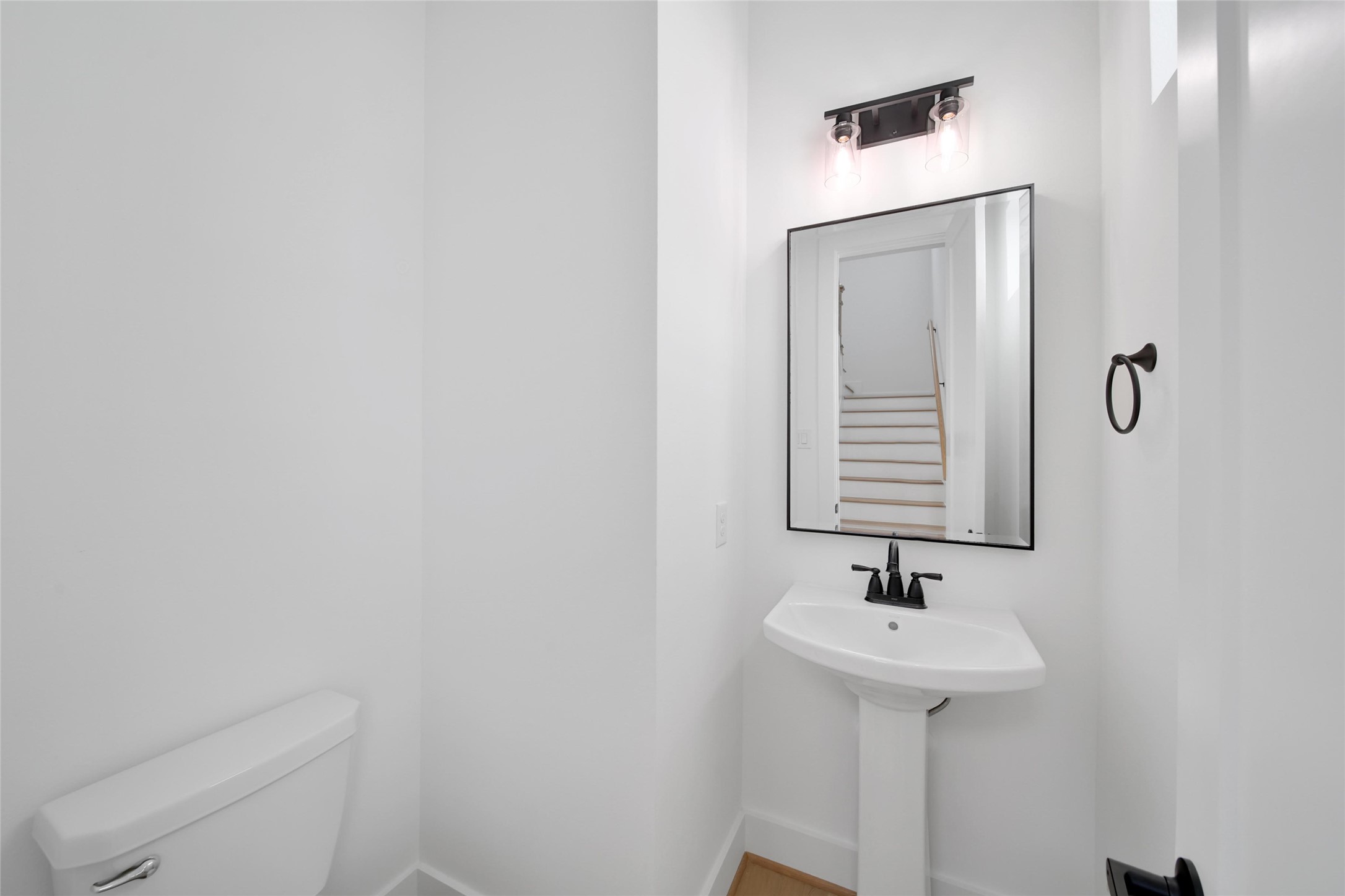 717 Marcella Street, Unit F Houston, TX 77091 - Photo 26 of 37 a bathroom with a sink a mirror and toilet