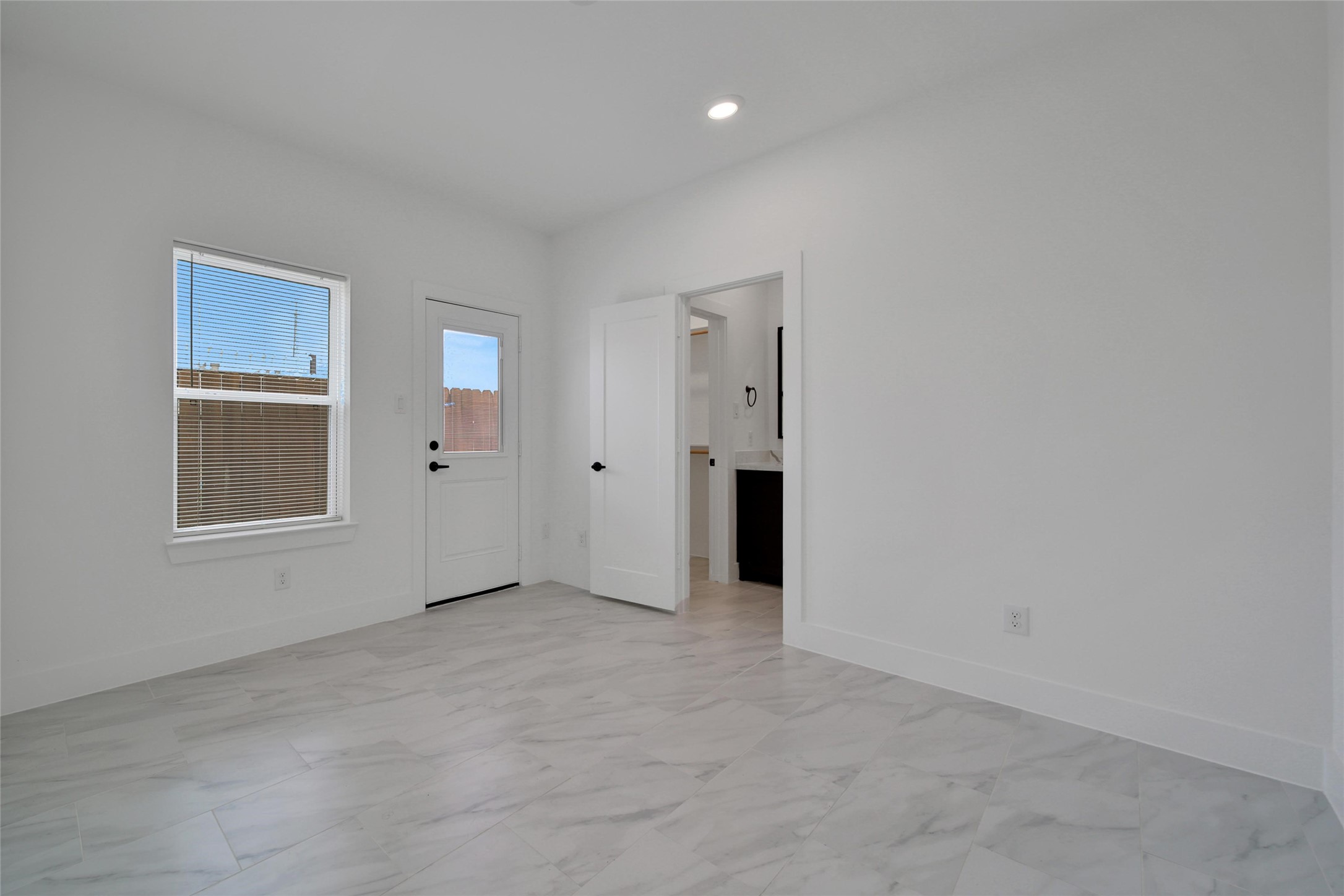 717 Marcella Street, Unit F Houston, TX 77091 - Photo 30 of 37 a view of an empty room with a window