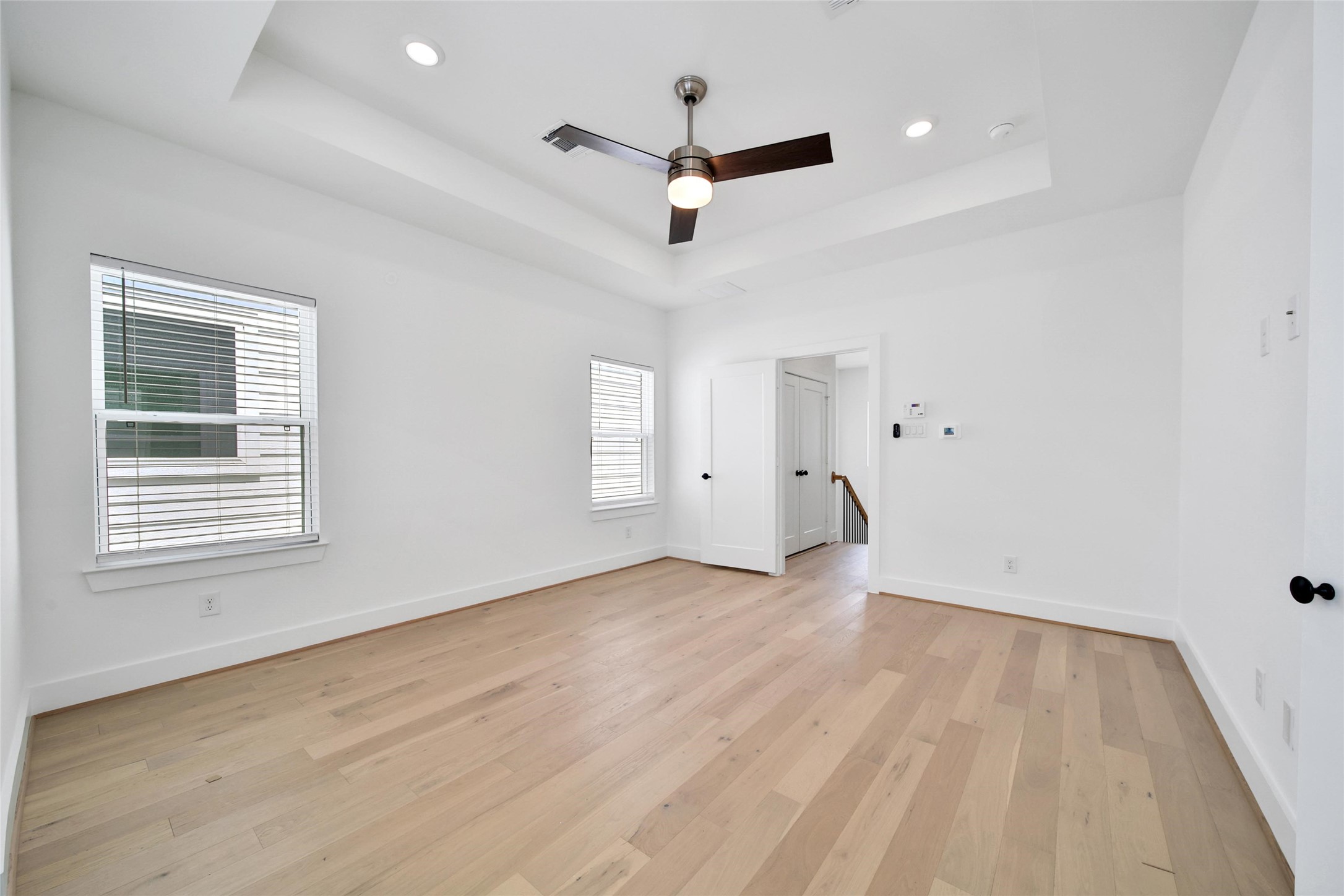717 Marcella Street, Unit F Houston, TX 77091 - Photo 7 of 37 a view of empty room with wooden floor and ceiling fan