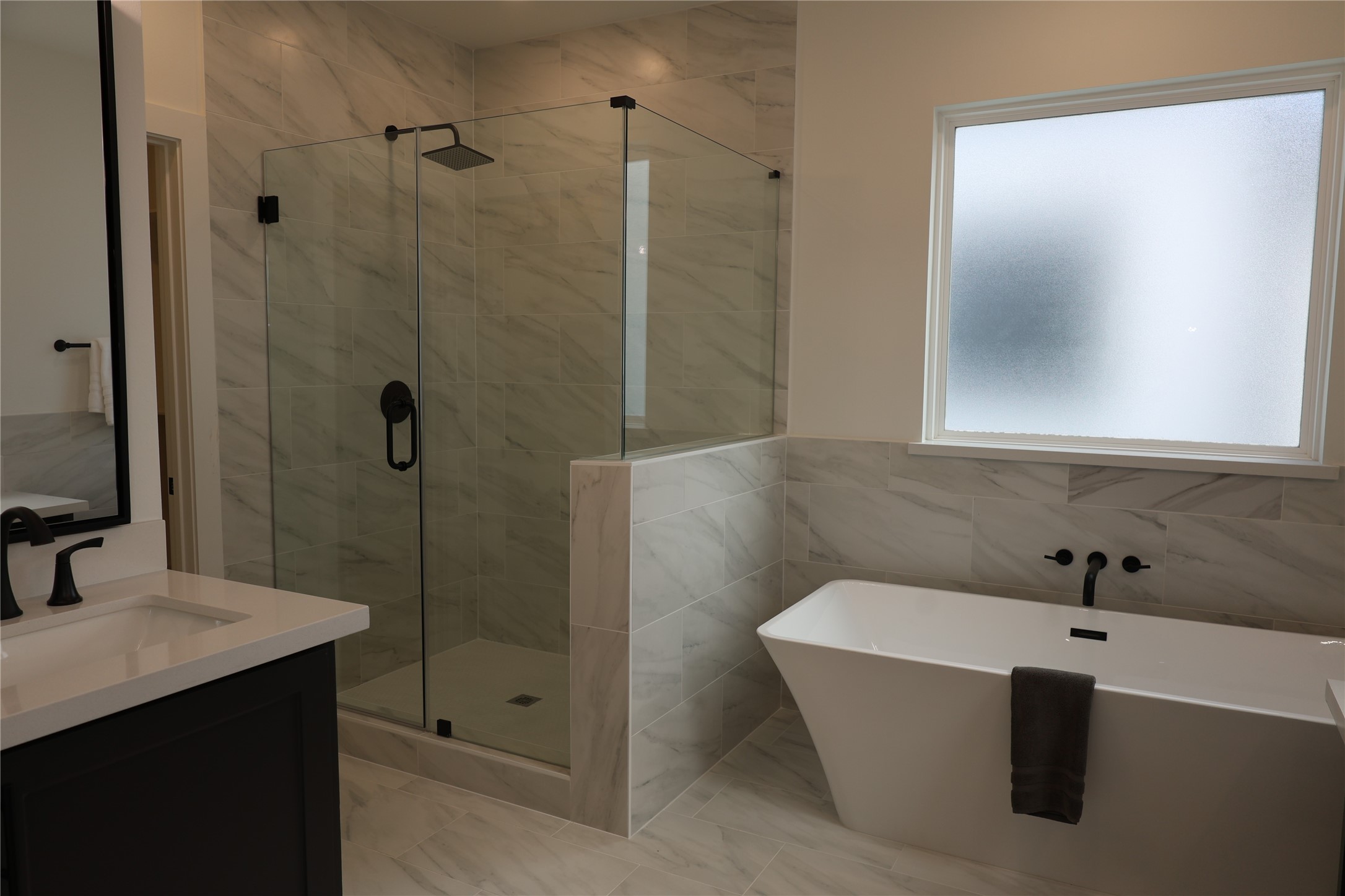 717 Marcella Street, Unit F Houston, TX 77091 - Photo 9 of 37 a bathroom with a bathtub and shower