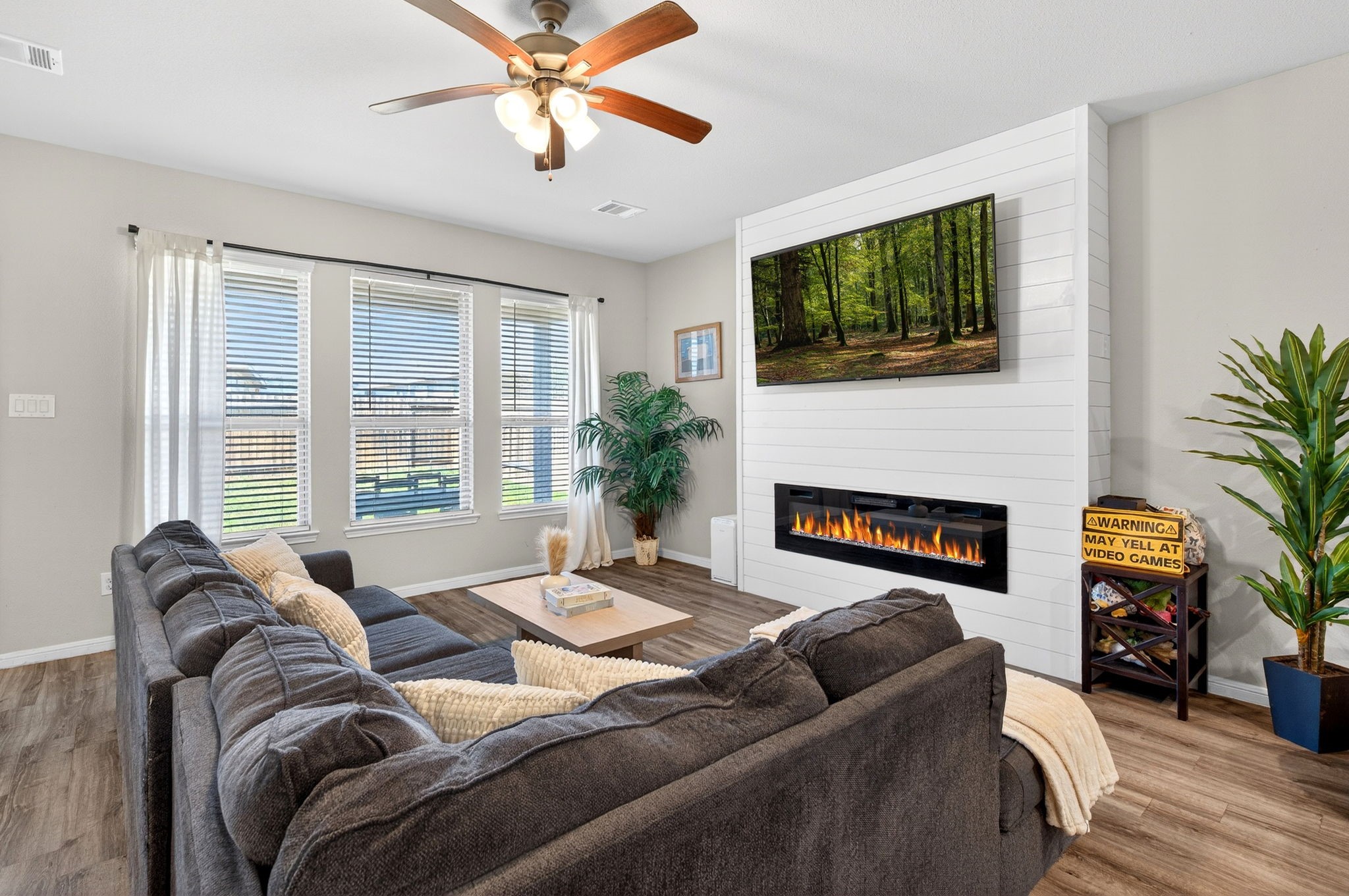 2121 Cedar Way Drive Conroe, TX 77301 - Photo 10 of 27 a living room with furniture fireplace and flat screen tv