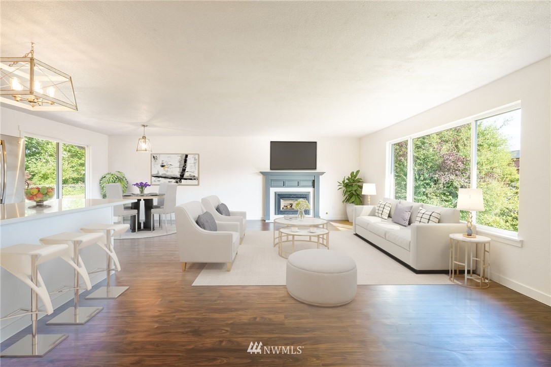 1620 Index Avenue Southeast Renton, WA 98058 - Photo 11 of 39 a living room with fireplace furniture and a large window