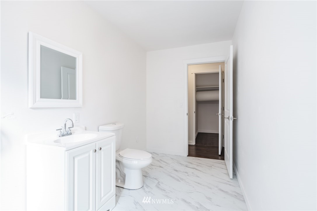 1620 Index Avenue Southeast Renton, WA 98058 - Photo 14 of 39 a bathroom with a sink toilet and vanity