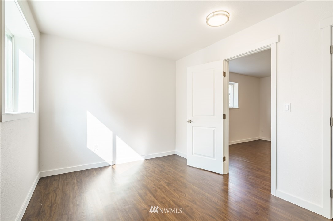 1620 Index Avenue Southeast Renton, WA 98058 - Photo 19 of 39 a view of an empty room and wooden floor