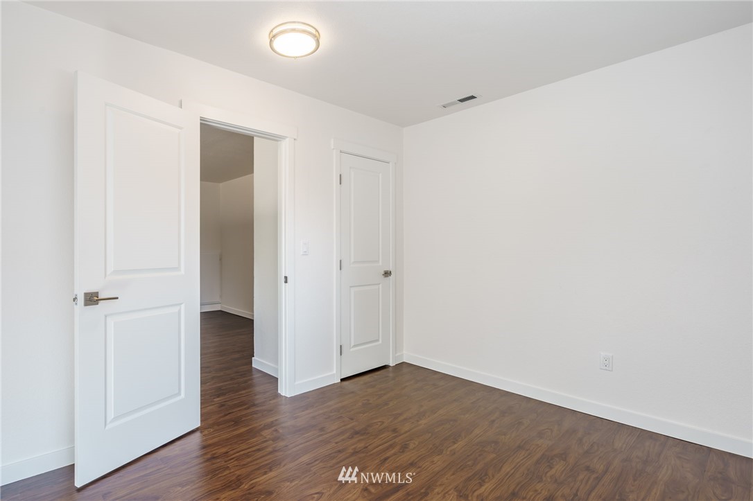 1620 Index Avenue Southeast Renton, WA 98058 - Photo 20 of 39 a view of an empty room with wooden floor