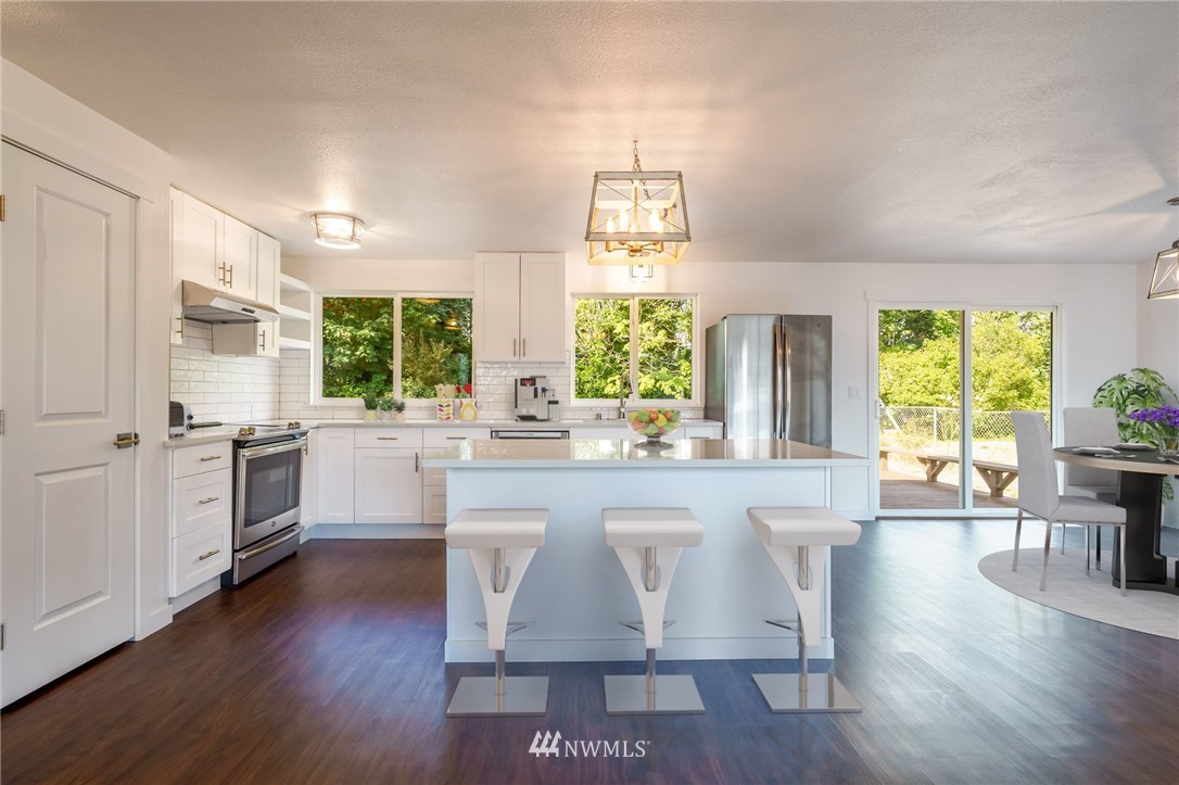 1620 Index Avenue Southeast Renton, WA 98058 - Photo 3 of 39 a large kitchen with a table and chairs in it