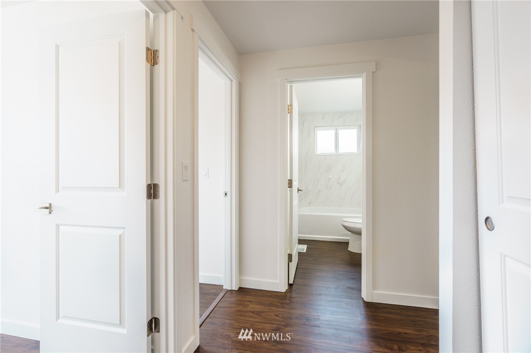 1620 Index Avenue Southeast Renton, WA 98058 - Photo 22 of 39 a view of a hallway with wooden floor