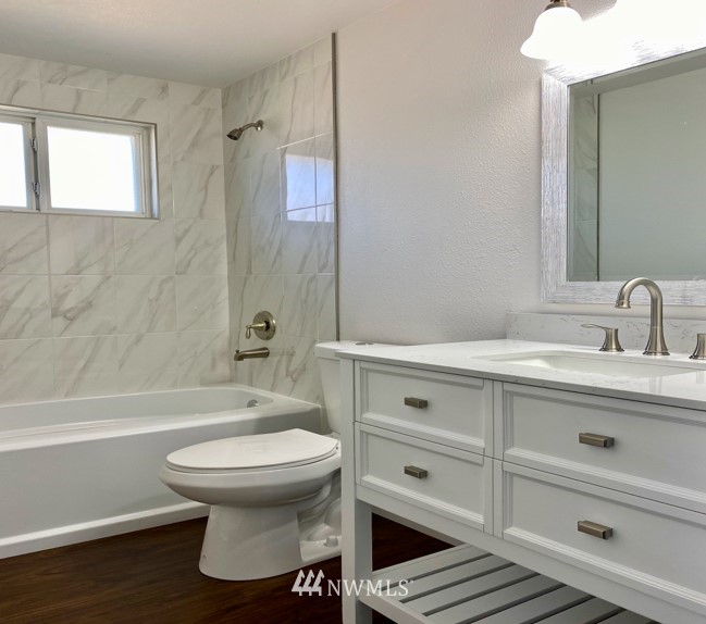 1620 Index Avenue Southeast Renton, WA 98058 - Photo 23 of 39 a bathroom with a sink toilet a shower and bathtub