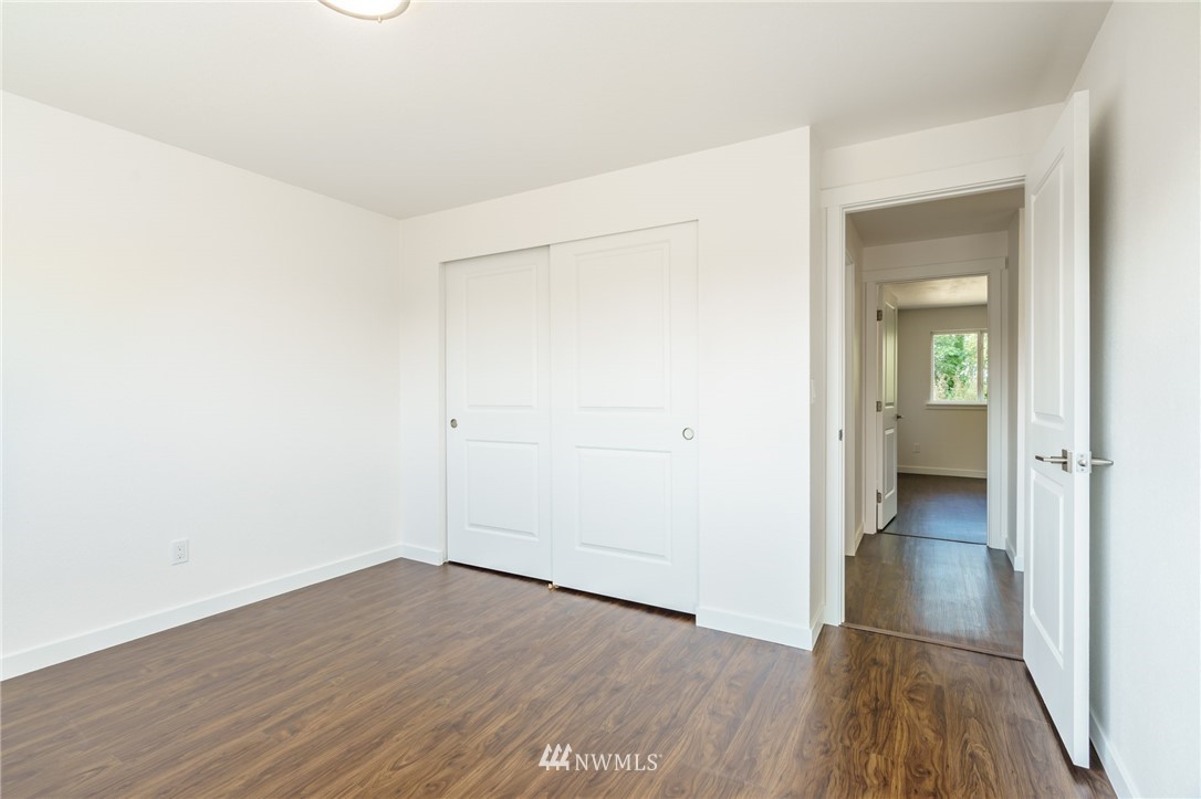 1620 Index Avenue Southeast Renton, WA 98058 - Photo 27 of 39 an empty room with wooden floor