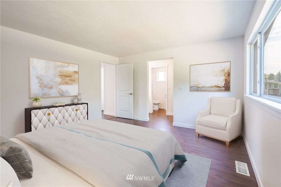 1620 Index Avenue Southeast Renton, WA 98058 - Photo 28 of 39 a bedroom with a bed and a couch