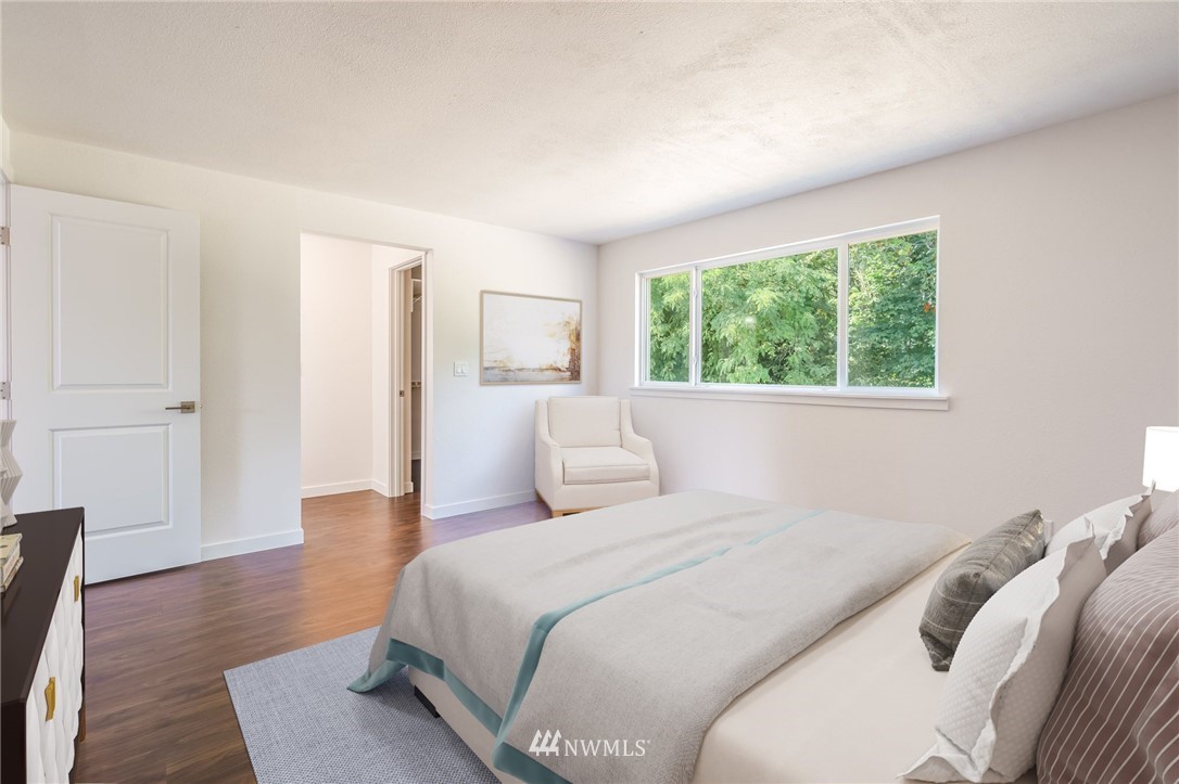 1620 Index Avenue Southeast Renton, WA 98058 - Photo 30 of 39 a bedroom with a bed and a large window