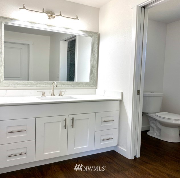 1620 Index Avenue Southeast Renton, WA 98058 - Photo 31 of 39 a bathroom with a sink a toilet and a mirror