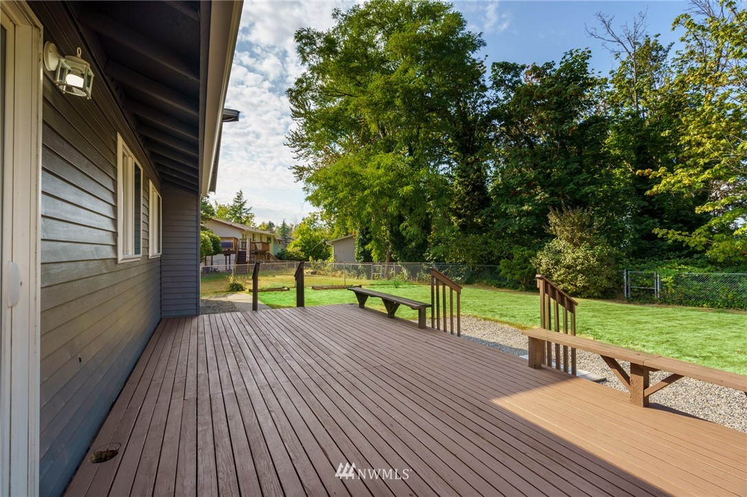 1620 Index Avenue Southeast Renton, WA 98058 - Photo 35 of 39 a view of a deck with wooden floor and fence