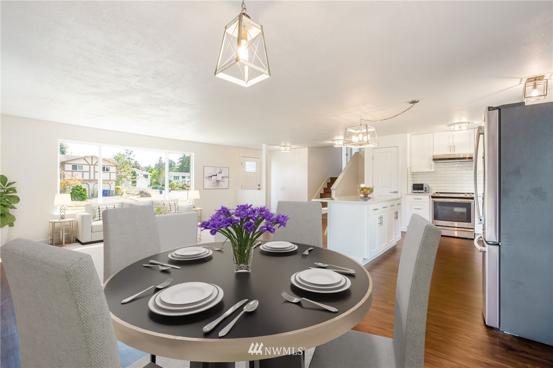 1620 Index Avenue Southeast Renton, WA 98058 - Photo 7 of 39 a kitchen with a dining table and chairs
