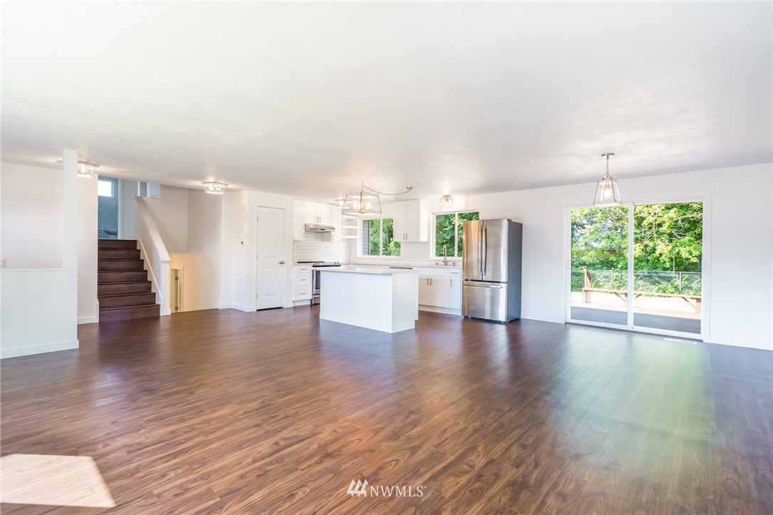 1620 Index Avenue Southeast Renton, WA 98058 - Photo 8 of 39 a view of a kitchen with wooden floor and a window