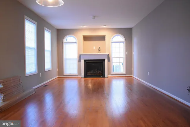 a kitchen with stainless steel appliances granite countertop a refrigerator stove microwave and sink