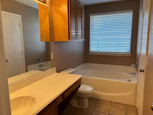 a bathroom with a sink and a bath tub