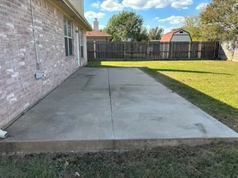 a view of a swimming pool with a yard