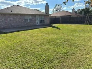 a view of a back yard of the house