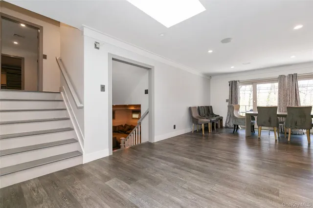 a view of dining room with furniture and wooden floor