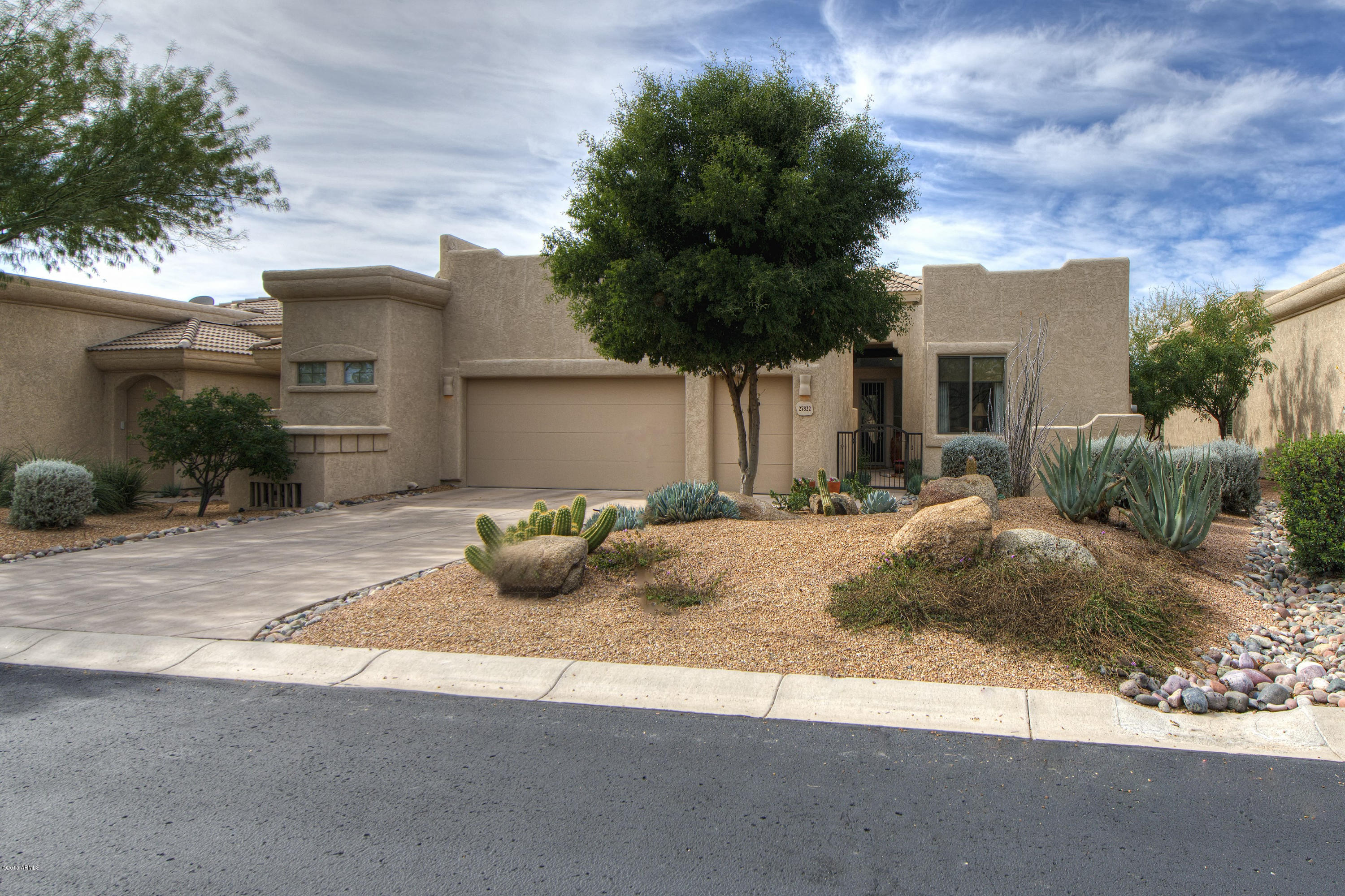 a view of a house with a yard and garage