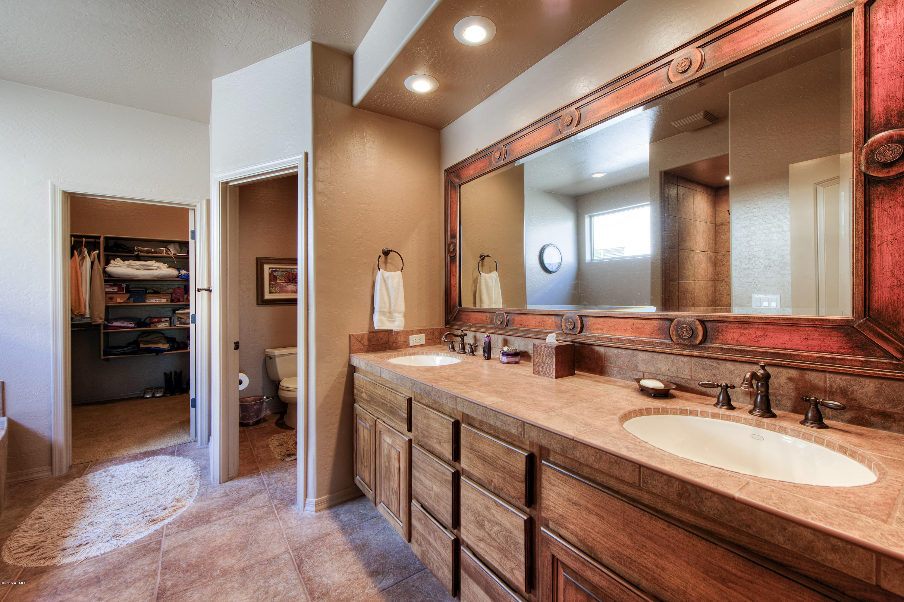 27822 North Quail Spring Road Rio Verde, AZ 85263 - Photo 11 of 33 a bathroom with a granite countertop sink mirror and double