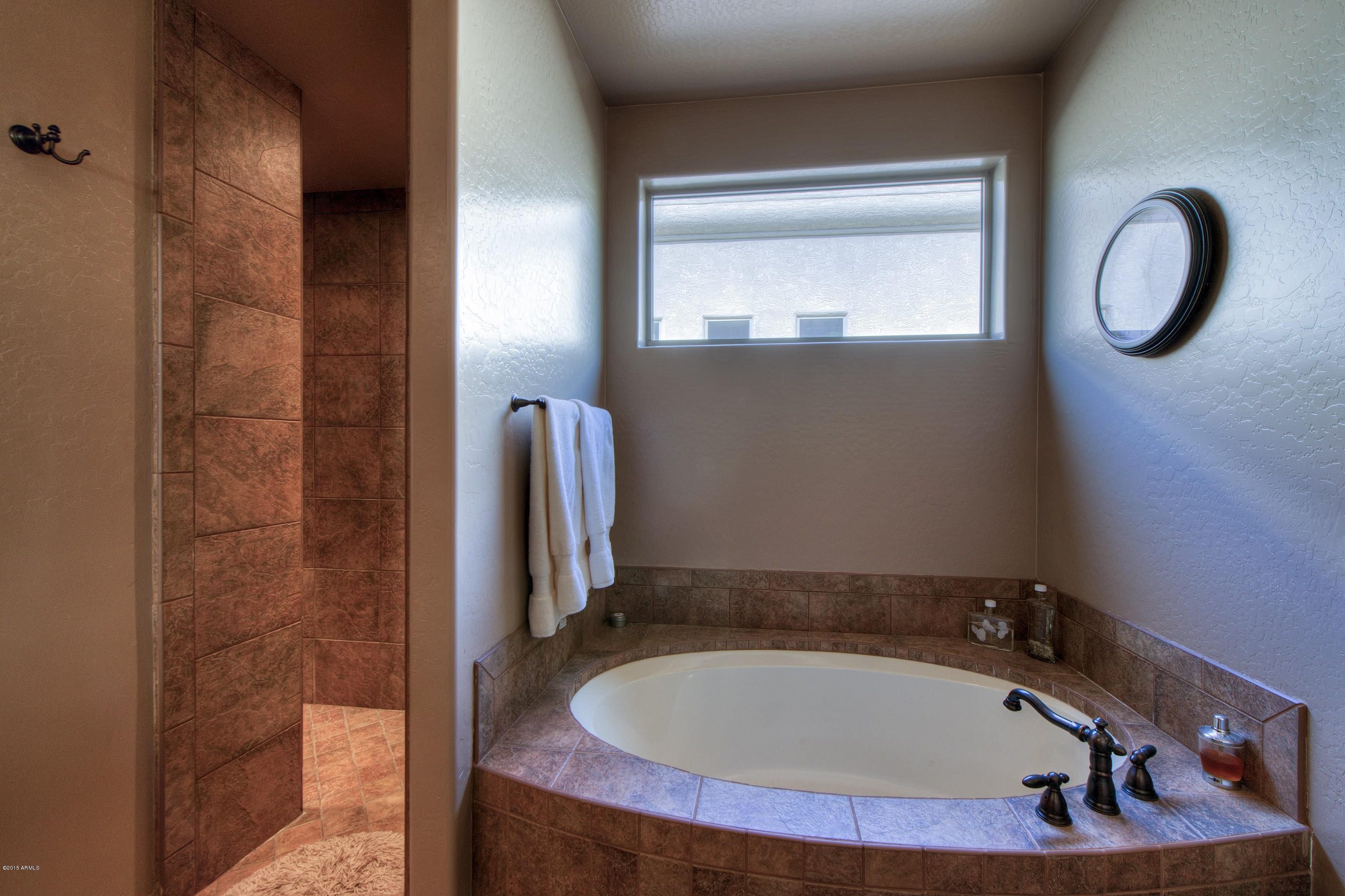 27822 North Quail Spring Road Rio Verde, AZ 85263 - Photo 12 of 33 a bathroom with a sink and a mirror