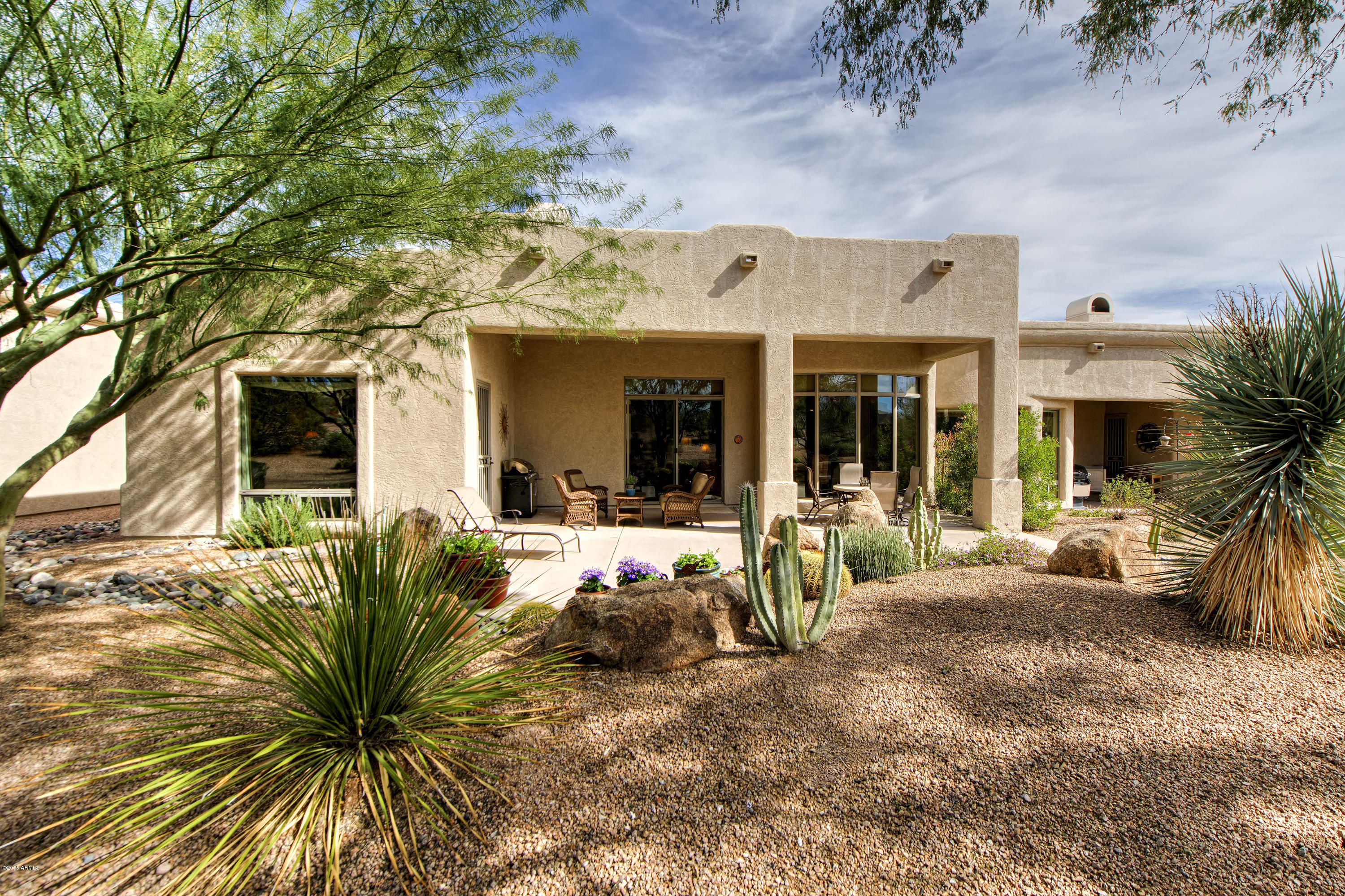 27822 North Quail Spring Road Rio Verde, AZ 85263 - Photo 17 of 33 a view of a house with backyard outdoor seating area