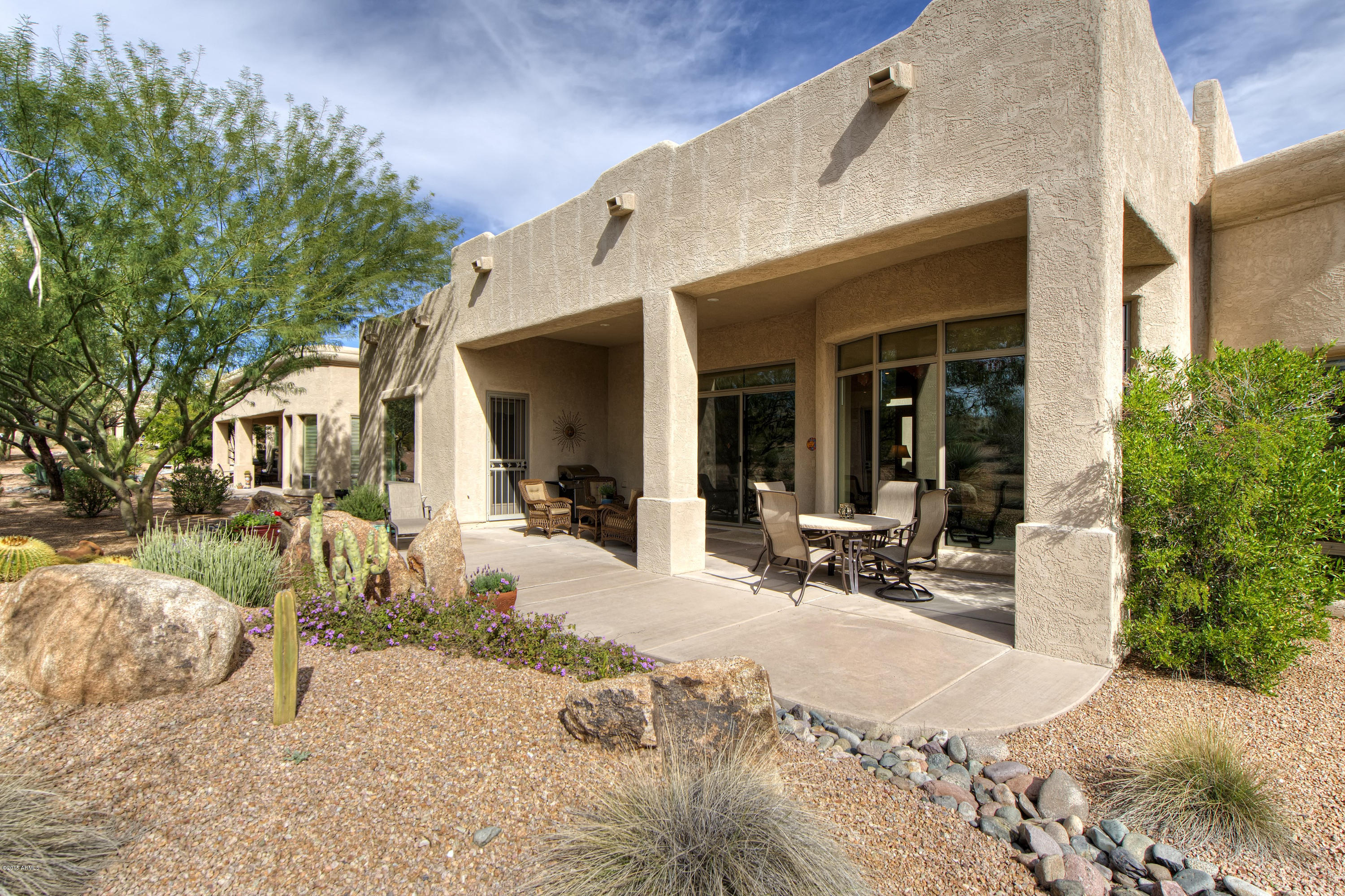 27822 North Quail Spring Road Rio Verde, AZ 85263 - Photo 18 of 33 a view of a dinning table and chairs in patio of the house