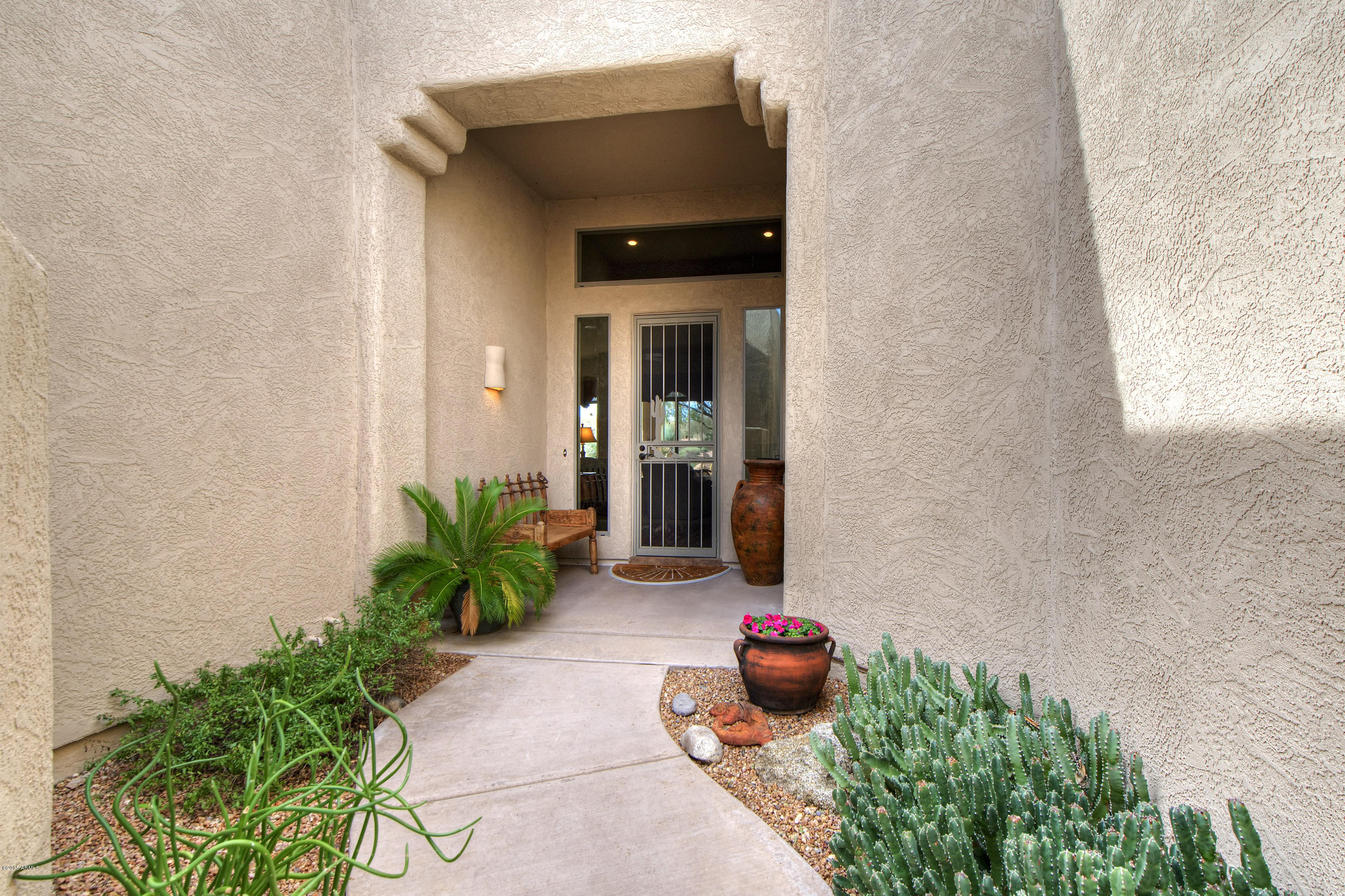 27822 North Quail Spring Road Rio Verde, AZ 85263 - Photo 2 of 33 a front view of a house having patio