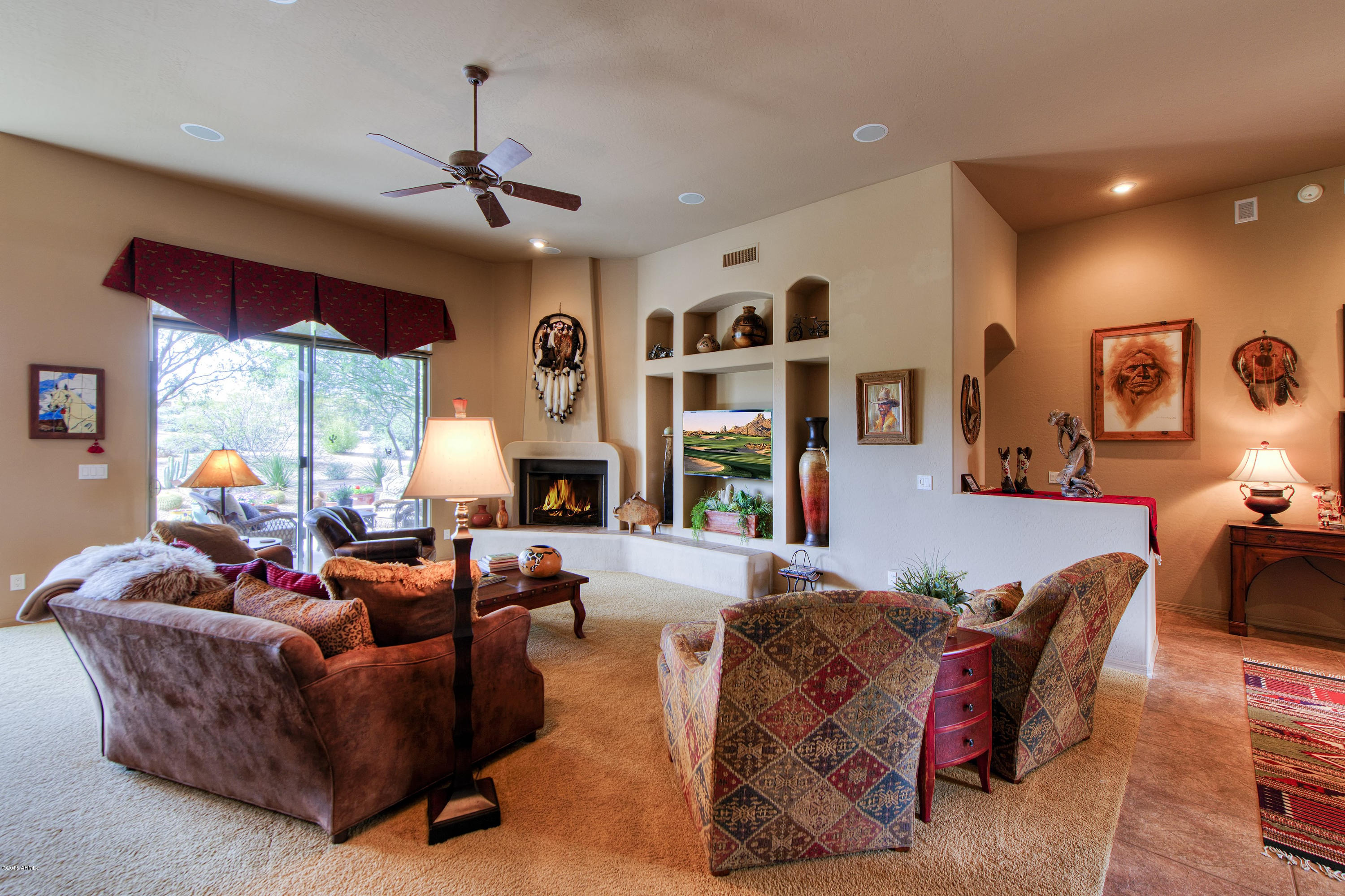 27822 North Quail Spring Road Rio Verde, AZ 85263 - Photo 3 of 33 a living room with furniture fireplace and large windows