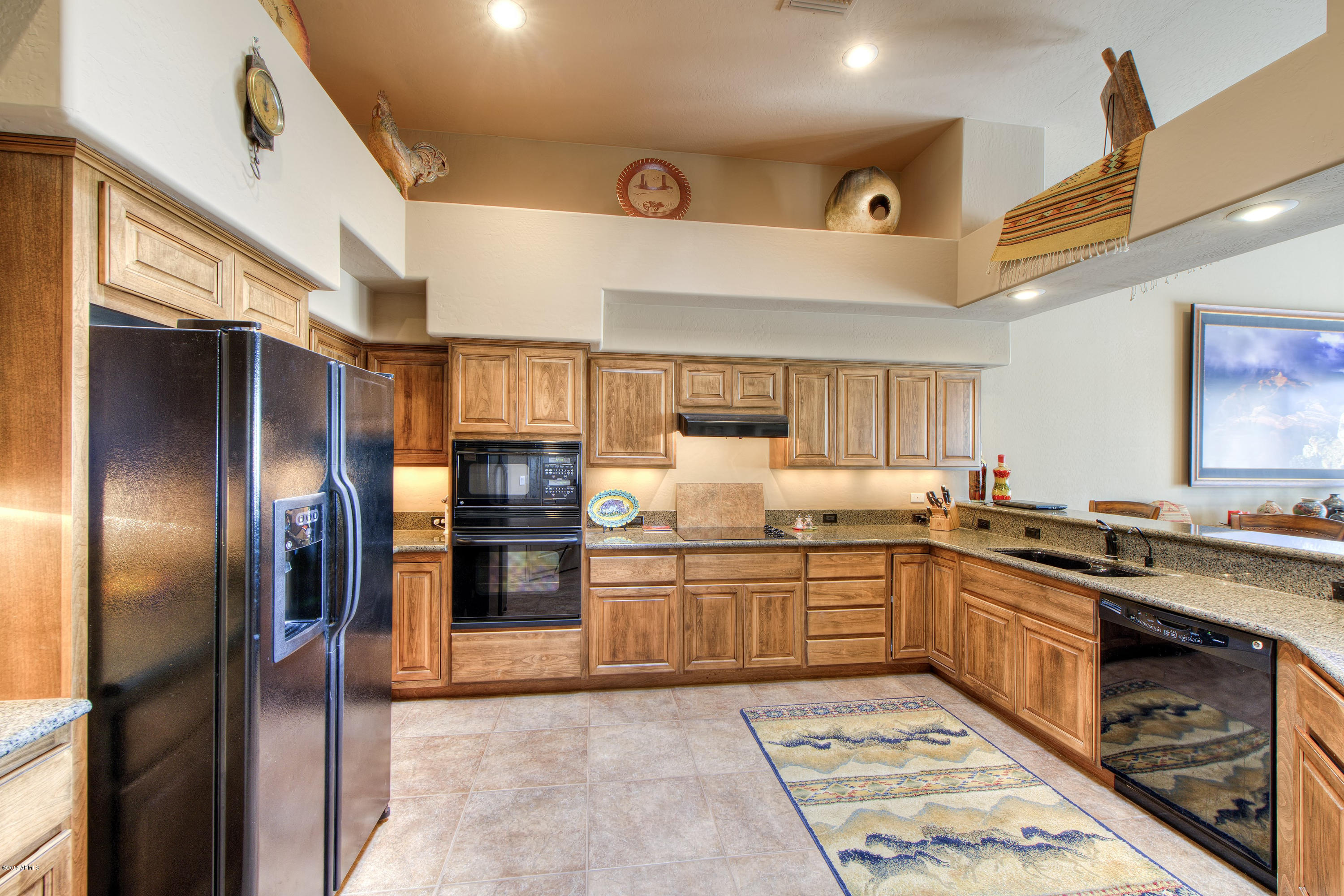 27822 North Quail Spring Road Rio Verde, AZ 85263 - Photo 8 of 33 a kitchen with stainless steel appliances granite countertop a refrigerator and a sink