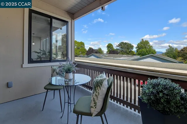 a view of a balcony with furniture