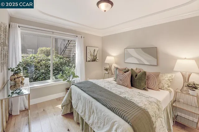 a bedroom with a large bed and a window