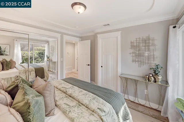 a bedroom with a large bed and a couch