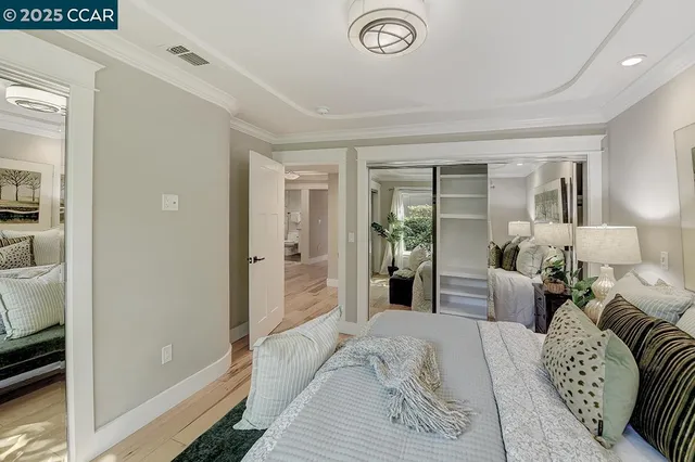 a bedroom with furniture and a window