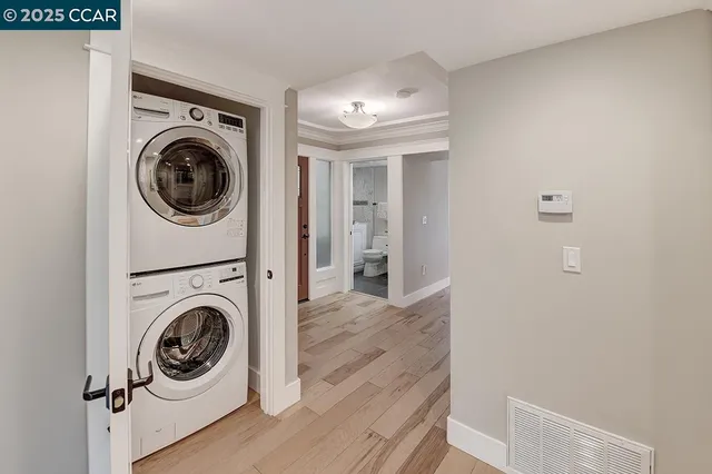 a view of a hallway with washer and dryer