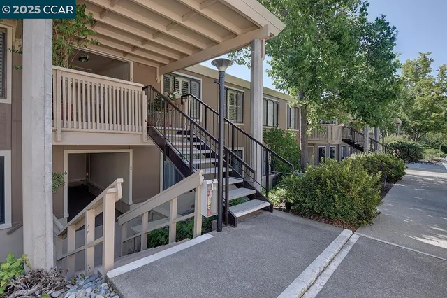 a view of a building with a yard