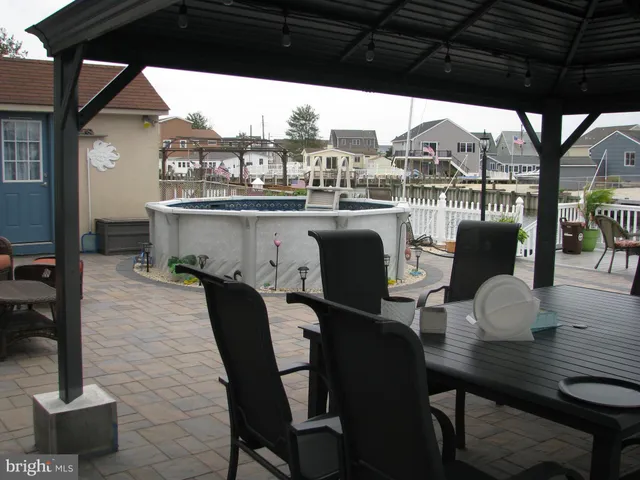 a patio with table and chairs