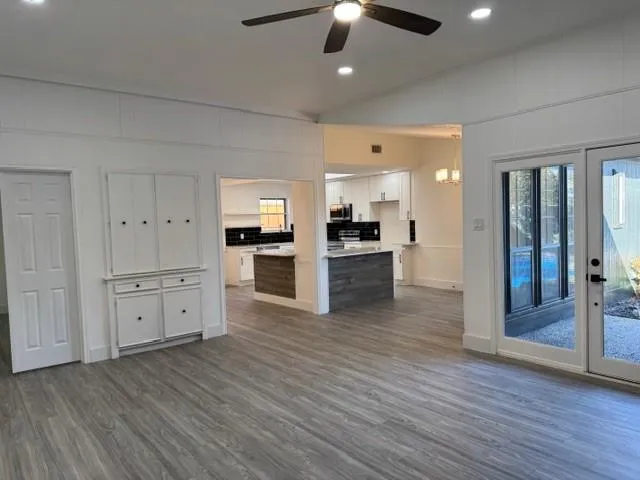 wooden floor in an empty room with a fireplace