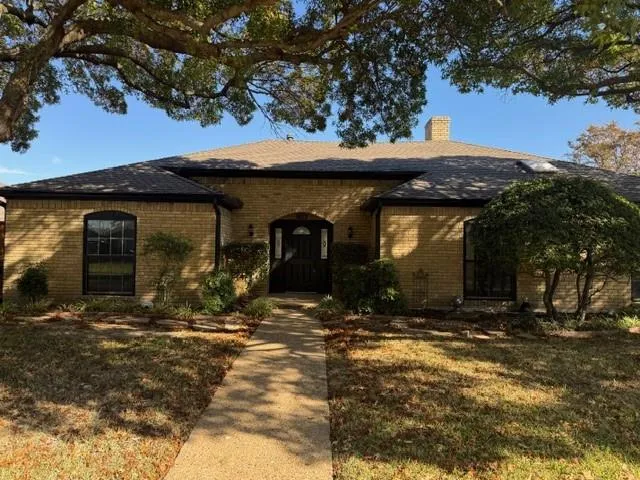 a view of a house with a tree