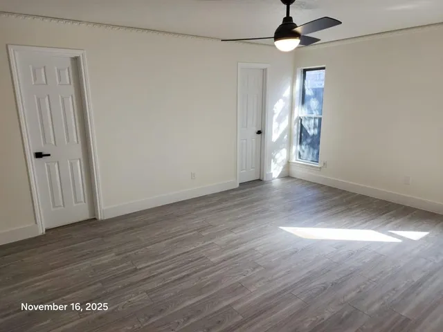 a bathroom with a sink mirror and vanity