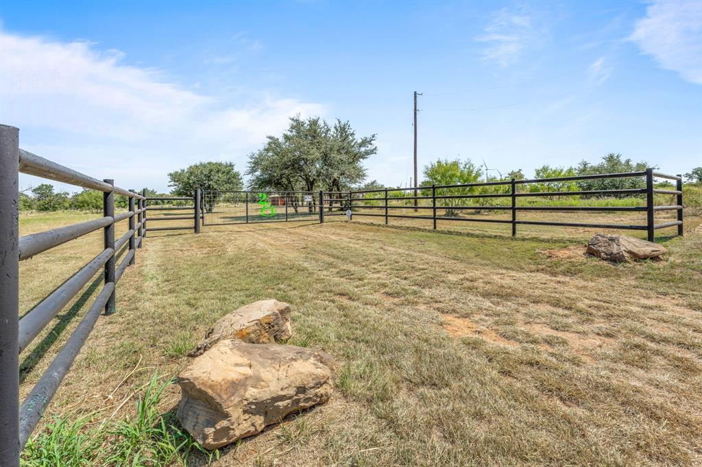 1712 Wells East Road Newcastle, TX 76372 - Photo 22 of 40 a view of a yard with wooden fence