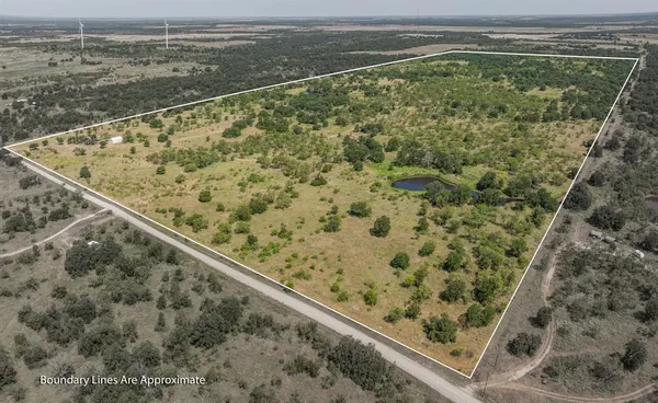 a view of a field with an outdoor space