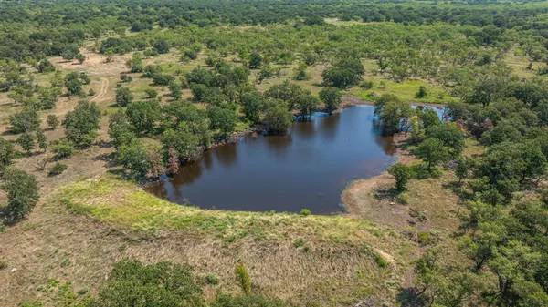 a view of a lake with a yard