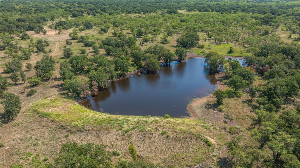 1712 Wells East Road Newcastle, TX 76372 - Photo 4 of 40 a view of a lake with a yard
