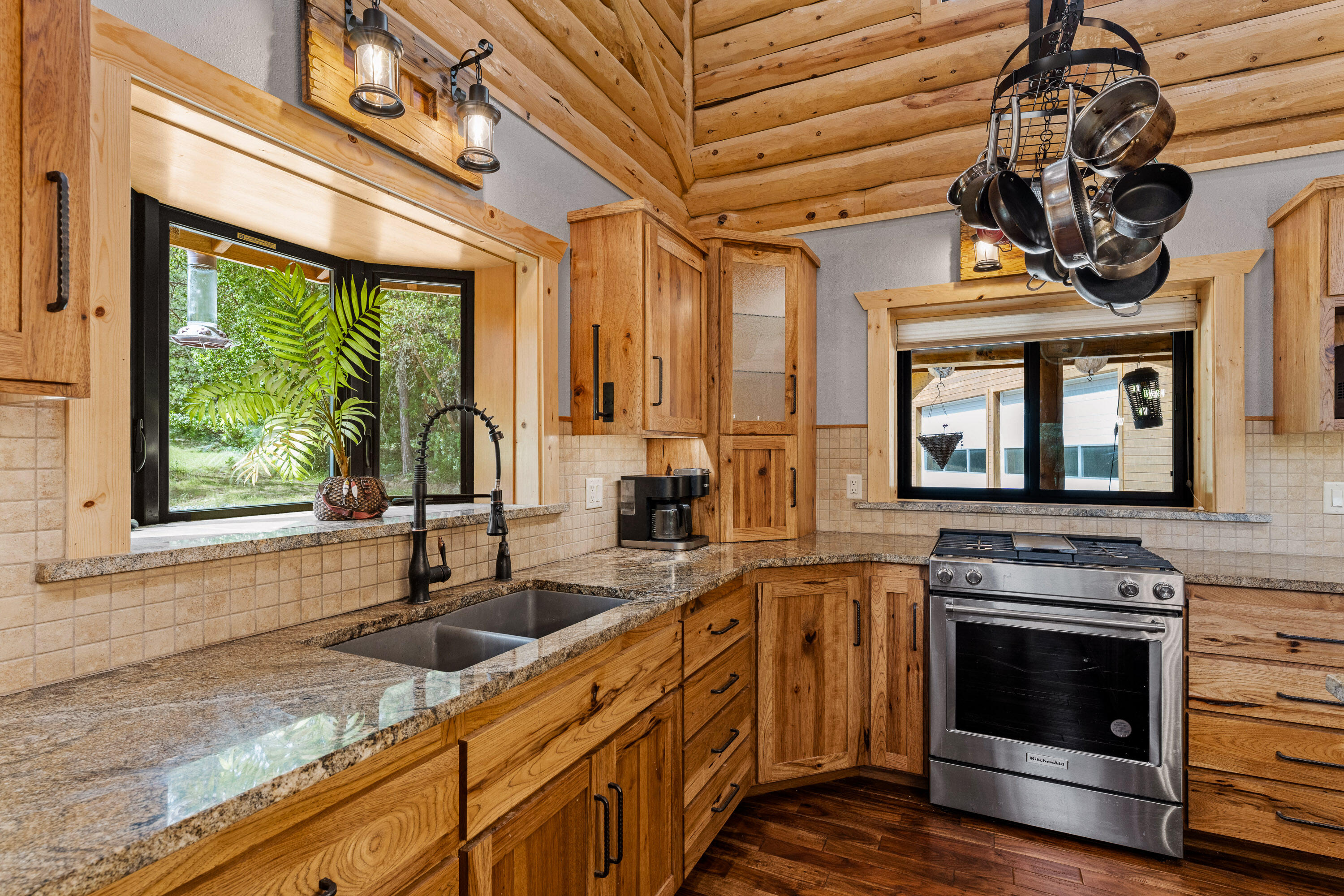 225 Eagle Ridge Road Canyonville, OR 97417 - Photo 31 of 52 a kitchen with a stove a sink and a microwave